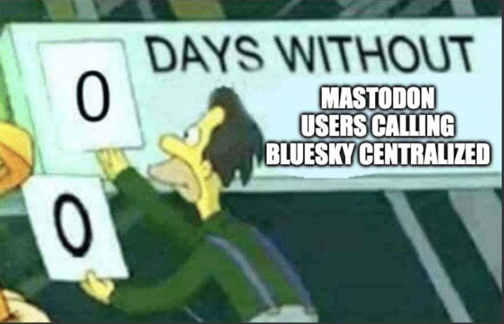 A sign saying "0 days without Mastodon users calling Bluesky decentralized" with Lenny from the Simpsons replacing the 0 with another 0